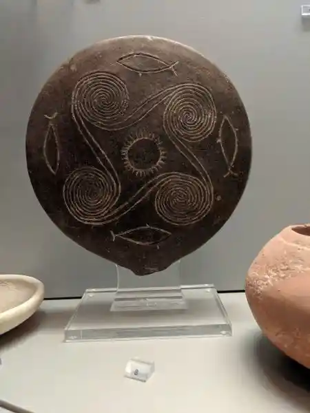 Cycladic ceramic frying pan with sun wheel and sea symbols